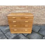 A LIGHT OAK CHEST OF TWO SHORT AND THREE LONG DRAWERS in the manner of Heals/Gordon Russell, with