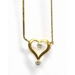 A 9CT GOLD DIAMOND SET HEART NECKLACE the openwork heart set with two round cut diamonds on an