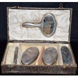 A CASED SET OF SILVER to include a silver backed mirror, three silver backed clothes brushes and a