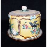 A VICTORIAN MAJOLICA CHEESE DISH cover with water lily knop, the sides with alternating reserves