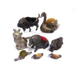 A COLLECTION OF VINTAGE PIN CUSHIONS Eight animal design pin cushions in metal