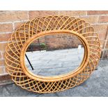 AN OVAL WALL MIRROR in wicker frame, 80cm x 66cm overall Condition Report : good condition, no