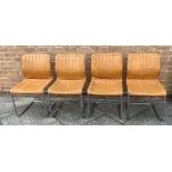 A SET OF FOUR TUBULAR CHROMED STEEL FRAMED CANTILEVER CHAIRS with tan leatherette upholstery