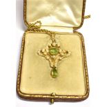 AN ART NOUVEAU PERIDOT AND SEED PEARL PENDANT PIECE Suspended from a 9ct gold rope twist chain,