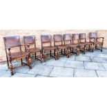 SET OF EIGHT (6+2) OAK AND LEATHER DINING CHAIRS having padded back and seats with brass studded