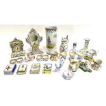 FRENCH FAIENCE: A MIXED COLLECTION including two clock cases, salts, figures of a dog and cow,