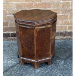 AN OCTAGONAL METAL BOUND OAK CELLARETTE 38cm wide 48cm high Condition Report : no liner, a little