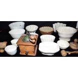 KITCHENALIA: A COLLECTION OF CERAMICS JELLY MOULDS, butter pats and a coffee grinder Condition