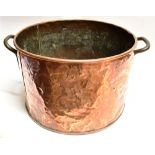 A LARGE COPPER CYLINDRICAL LOG BIN with loop handles, 46cm diameter 31cm high Condition Report :