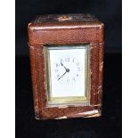 AN EDWARDIAN BRASS CASED CARRIAGE CLOCK with repeat mechanism, the enamel dial with Arabic numerals,