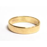 A YELLOW METAL WIDE BAND RING Marked 375 to the shank, ring size W - X band width 0.5cm, weight 3.