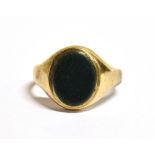 A 9CT GOLD VINTAGE SIGNET RING Fitted with a black hardstone bezel, the shank with faded 375