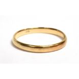 A YELLOW METAL BAND RING Stamped 18C, ring size Q ½, weight 1.7g
