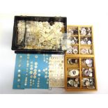 A COLLECTION OF MOTHER OF PEARL BUTTONS (three boxes).
