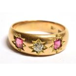 AN 18CT GOLD, DIAMOND AND RUBELITE GYPSY RING The ring set with a central European cut diamond