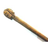 A KEPKYPA [CORFU, GREECE] CARVED WOOD WALKING CANE the knop with four stylized male faces, the