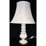 A PORCELAIN TABLE LAMP BASE with floral relief decoration, 38cm high excluding electrical fitting