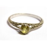 AN 18CT WHITE GOLD YELLOW SAPPHIRE RING The ring set with a round cut yellow sapphire measuring
