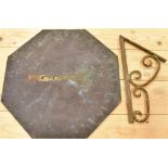AN OCTAGONAL BRONZE SUNDIAL the chapter ring with Roman numerals and fleur-de-lys hapf hour markers,