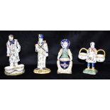 A GROUP OF FOUR FRENCH FAIENCE FIGURAL SALTS and a figure of a French soldier, all typically