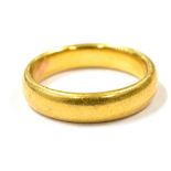 A 22CT GOLD BAND RING Rubbed hallmark to the shank, ring size J ½, weight 5.7g