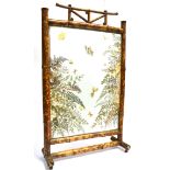 A VICTORIAN BAMBOO FRAMED FIRESCREEN the glazed panel decorated with butterflies, ferns and flowers,