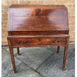 A GEORGE III MAHOGANY BUREAU ON STAND the fall front opening to interior fitted with pigeonholes and