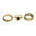 THREE 9CT GOLD RINGS Comprising of a 9ct gold band ring; a 9ct gold open work ring with bezel signet