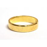 AN 18CT GOLD BAND RING Hallmarked for London 1987, ring size L, weight 3.5g.