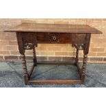 A PROVINCIAL OAK SIDE TABLE the three plank top with moulded edge, frieze with single drawer and