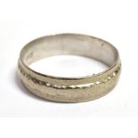 A WHITE METAL BAND RING With raised central ribbed band, marked 18CT to the shank, ring size P, band