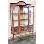 AN EDWARDIAN MAHOGANY DISPLAY CABINET with painted decoration, central bow front glazed door,