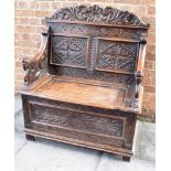 A SMALL CARVED OAK HALL BOX SETTLE 90cm wide 106cm high Condition Report : hinges to lift up seat