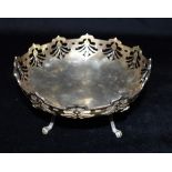 A SILVER FOOTED BOWL the bowl with openwork decoration to the top and standing on four feet