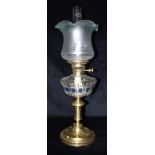 AN EDWARDIAN DOUBLE BURNER OIL LAMP with acid etched glass tulip shaped shade, stained and cut glass
