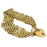 A 9CT GOLD HEART PADLOCK SIX GATE BRACELET The padlock marked 375 London, make RB Ltd, fitted with a
