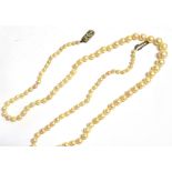 A DIAMOND ACCENTED CLASP SINGLE STRAND CULTURED PEARL NECKLACE the graduated pearls measuring from