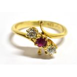 AN 18CT GOLD, DIAMOND AND RUBY CROSSOVER RING With faded 18ct stamp to the shank, ring size L ½,