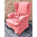 A WING ARMCHAIR with loose cover, on square tapering supports Condition Report : frame is solid, but
