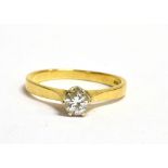 AN 18CT GOLD DIAMOND SOLITAIRE RING The round cut diamond measuring approx. 4mm in diameter, the