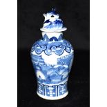 A SMALL CHINESE BALUSTER SHAPED VASE AND COVER underglaze blue painted decoration of a figure