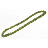 A 1920S NEPHRITE JADE NECKLACE The necklace comprising of graduated round beads, ranging from 6mm-