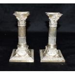 A PAIR OF EDWARDIAN WEIGHTED SILVER CANDLE STICKS In Corinthian style, hallmarked for Birmingham,