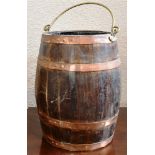 A COPPER BOUND OAK BARRELL STICK STAND with brass swing handle and metal liner, 43cm high