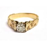 A 9CT GOLD DIAMOND SOLITAIRE RING with half patterned shank set with a small single cut diamond