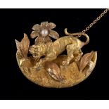 A VICTORIAN LION BROOCH the brooch finely carved in yellow metal with rose and white metal detail