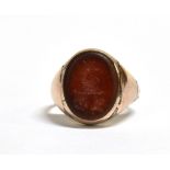 AN INTAGLIO RING ring size M, weight 4.9grams, the carnelian coloured hardstone seal with animal