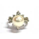 A DIAMOND AND PEARL COCKTAIL RING the single pearl measuring approx. 9mm in diameter, raised on a