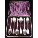 A CASED SET OF SIX VICTORIAN SILVER TEASPOONS with fancy back and cut out detail to the handle tips,