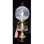 A LATE VICTORIAN OIL LAMP with acid etched globe shade, and facetted glass reservoir, 53cm high